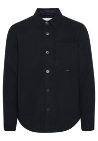 Black cotton shirt with long sleeves, button-up front, a pointed collar, and a single chest pocket. Soft texture and rounded hem design.