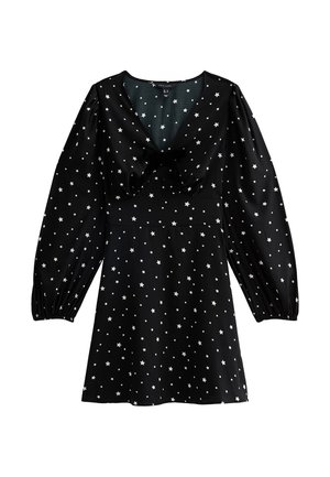 Zwarte jurk met lange pofmouwen, met een strikdetail bij de hals. Versierd met een wit sterrenpatroon over de hele jurk.