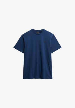 T-shirt in cotone blu navy con maniche corte, scollo rotondo e un piccolo logo stampato sul petto. Tessuto morbido e vestibilità comoda.