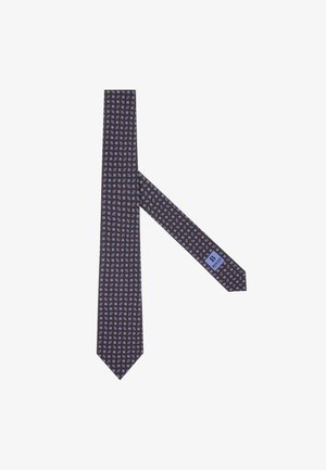 Cravate étroite en tissu marron foncé avec un motif floral léger bleu clair répété. Présente une étiquette à l'arrière près de l'extrémité inférieure.
