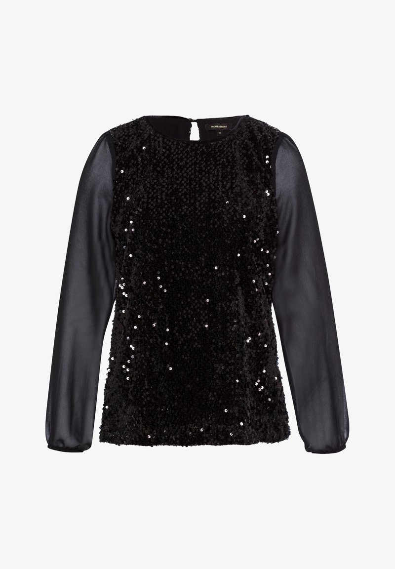 Haut noir à manches longues avec manches transparentes et devant couvert de sequins noirs brillants, encolure ronde et fermeture à bouton clé à l'arrière.