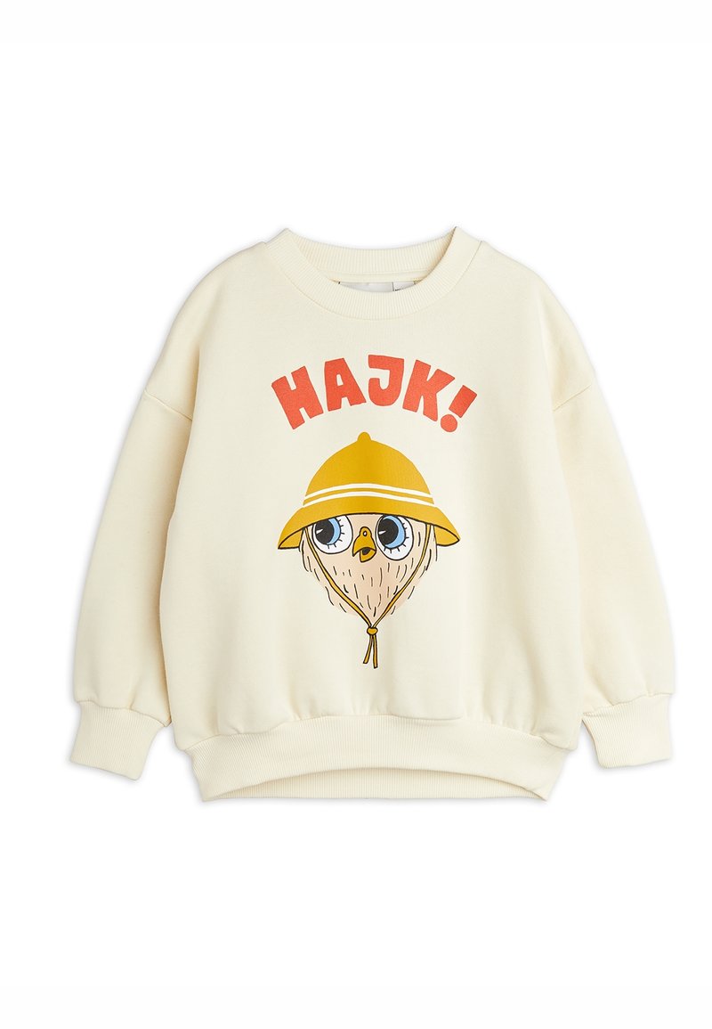 Sweatshirt crème en tissu doux, ornée d'un oiseau de dessin animé portant un chapeau jaune et du texte « HAJK ! » en lettres rouges grasses.