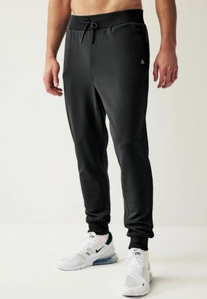 ACTIVE TEXTURED JOGGERS - Tracksuit bottoms - black