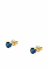 Goldene Ohrstecker mit ovalen blauen Edelsteinen, die mit vier Krappen gesichert sind, und ein glattes Finish sowie eine lebendige Farbe präsentieren.
