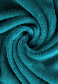 Teal, plush microfiber towel with a soft texture, featuring a swirling pattern. The fabric appears thick and absorbent.