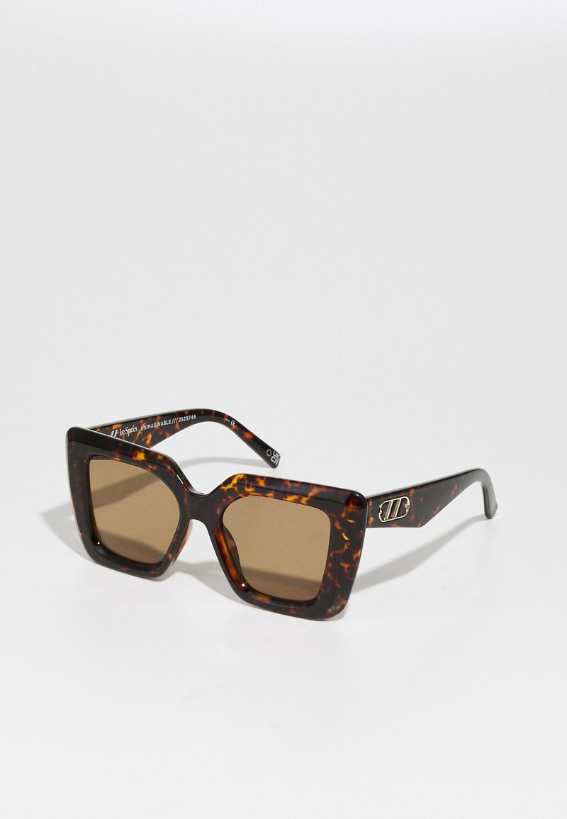 Square sunglasses with a tortoiseshell pattern, brown lenses, and gold hardware accents on the temples. Plastic frame.