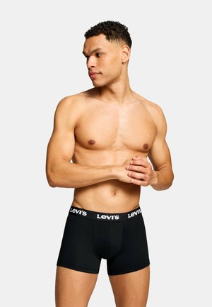 Schwarze Baumwoll-Boxershorts mit figurbetontem Schnitt, ausgestattet mit einem breiten Bund und weißem "Levi's"-Logo. Glatte Textur und mittlere Oberschenkellänge.