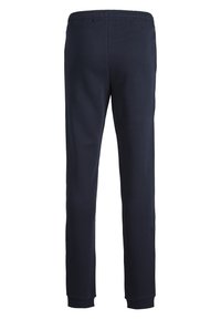 Pantaloni tuta blu navy con vita regolabile tramite cordino, polsini a coste e texture di tessuto liscia e morbida. La vista posteriore mette in evidenza la vestibilità e la forma sartoriale.