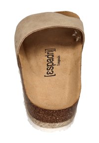 Beige suede slip-on sandal with a wide strap, cork footbed, and a natural jute sole. Features embossed brand logo on the insole.