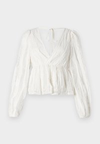 Blusa avvolgente bianca con maniche lunghe e gonfie, scollatura a V profonda e ricami floreali. Presenta una vita sfiancata e una chiusura a cravatta sul retro.