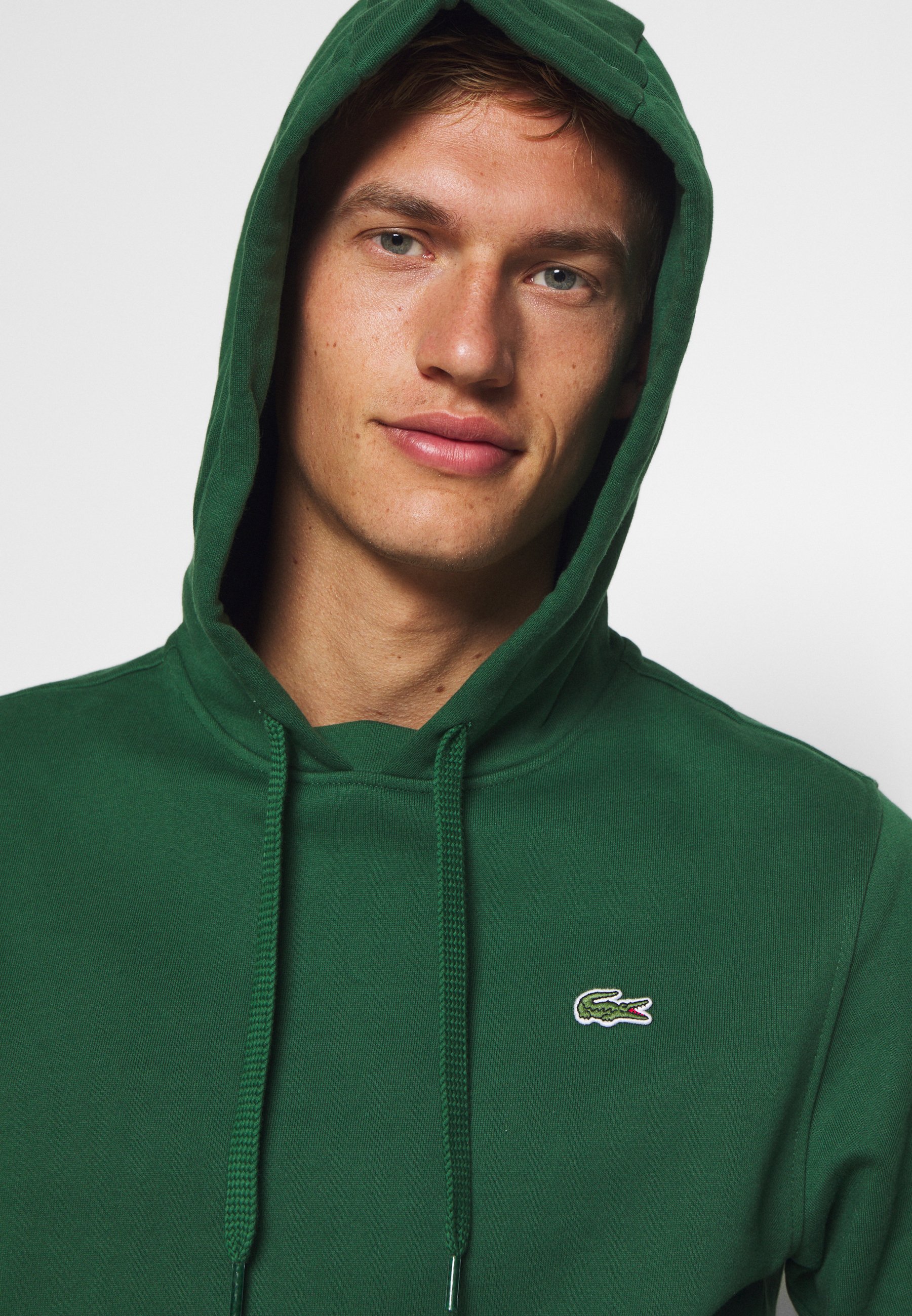 pull vert lacoste
