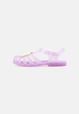 Translucent purple jelly sandal with closed toe, adjustable buckle strap, and colorful flower decoration on top.