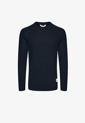 Navy blue ribbed knit sweater with long sleeves, round neckline, and a small label at the bottom left. Textured fabric structure.