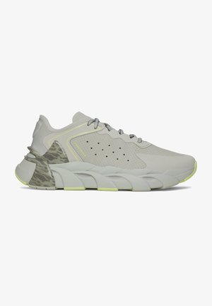 Light grey Under Armour athletic sneaker with textured upper, perforations, thick segmented sole, camouflage heel detail, and laces.