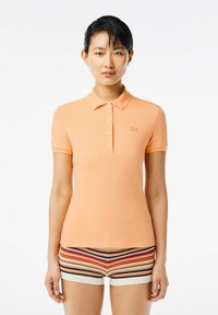 Lacoste Piké - orange clair ixy