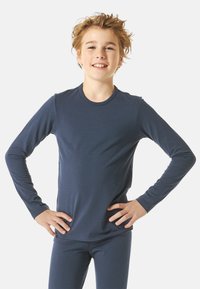 Navy blue long-sleeve shirt made of smooth fabric, featuring a round neckline, fitted sleeves, and paired with matching blue pants.
