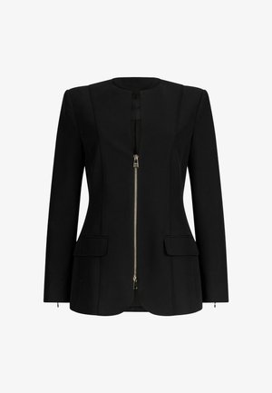 Black tailored jacket with a round neckline, featuring a front zipper, two patch pockets, and subtle stitching details. Smooth fabric texture.