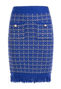 Sininen tweed-hame, jossa on teksturoitu kuvio kultaisilla yksityiskohdilla ja helmipainikkeilla, viimeistelty frangeilla. Kaksi etutaskua.