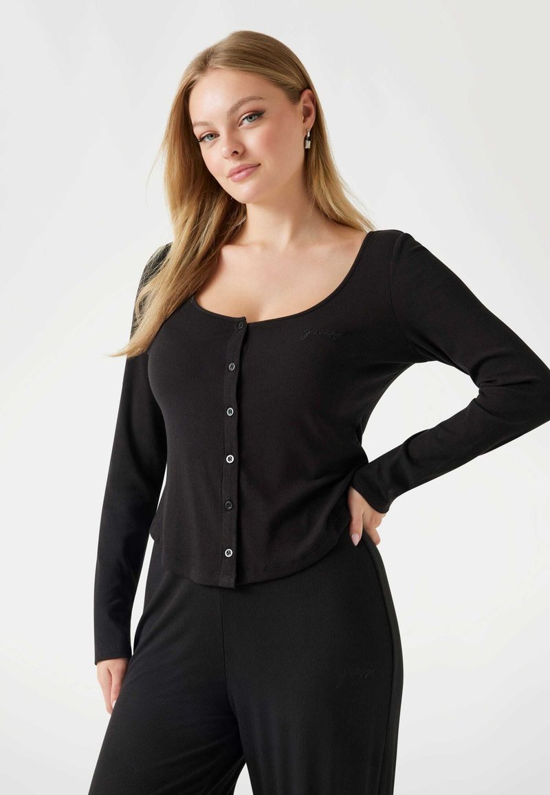 Black long-sleeve button-up top with a scooped neckline and ribbed texture. Features small buttons and a relaxed fit.