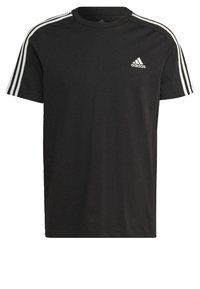 T-shirt in cotone nero con maniche corte, caratterizzata da un design a tre strisce bianche sulle spalle e un logo Adidas sul petto.