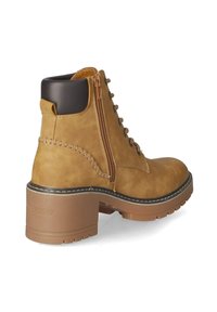 Brown leather ankle boot with zip closure, round toe, and block heel. Features decorative stitching and a contrasting black collar.