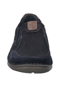 Navy suede slip-on shoe with brown leather accent and contrasting stitching. Rounded toe and flexible rubber sole for comfort.