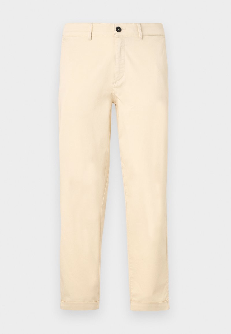 Beige chinos gemaakt van zachte katoenen stof, met een ritssluiting, knoopsluiting en opgerolde mouwen. Rechtopvallend ontwerp met minimale details.