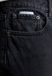 EYTYS CYRUS RAVEN - Flared Jeans - black