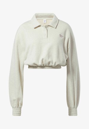 Felpa polo accorciata in tessuto grigio chiaro. Caratterizzata da un collo classico, maniche lunghe con polsini elastici e un logo sul petto.