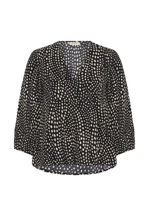 Blouse noire à pois blancs irréguliers éparpillés, col en V, manches trois-quarts et ourlet légèrement évasé.