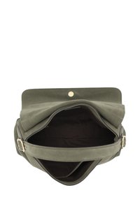 Green fabric tote bag with a roll top, featuring a magnetic snap closure and a black interior. Includes a flat strap and minimal hardware.