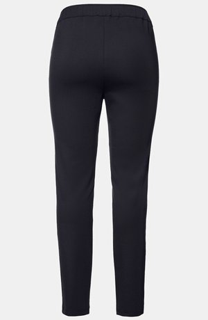 Pantaloni elastici neri con un design aderente, vita elastica e gambe affusolate. Tessuto liscio e leggero. Senza tasche visibili.