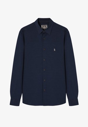 Navy button-up shirt made of textured fabric, featuring a pointed collar, long sleeves, and a small embroidered design on the left chest.