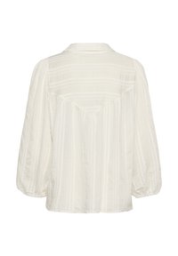 Blusa bianca leggera con vestibilità morbida, caratterizzata da uno yoke posteriore, righe verticali e maniche a sbuffo. Il tessuto testurizzato aggiunge profondità.