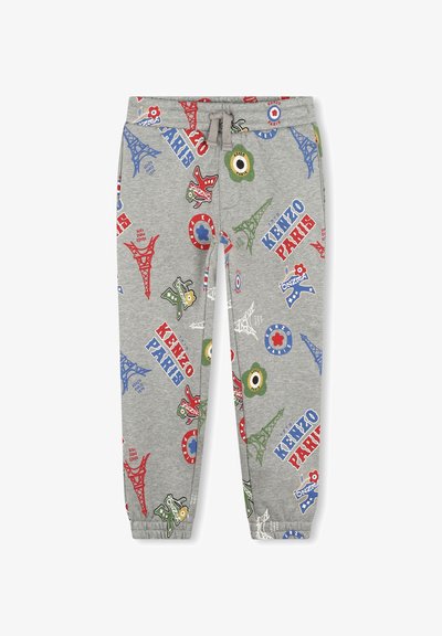 Pantalon de survêtement gris avec taille à cordon, présentant des imprimés colorés de la Tour Eiffel, de fleurs, et "KENZO PARIS" en rouge et bleu.