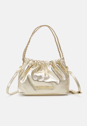 Gold metallic Valentino handbag with ruched top, dual chain handles, and detachable leather shoulder strap on plain white background.