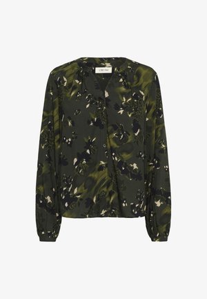 Blouse à manches longues vert foncé avec un motif floral noir et blanc, encolure ronde, fermeture à boutons sur le devant et poches froncées au niveau des manches.