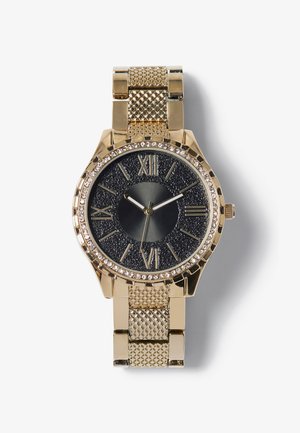 Relógio em tom dourado com um mostrador preto texturizado, números romanos e uma luneta decorada com cristais. Apresenta uma bracelete em malha e caixa redonda.