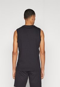 Champion ICONS SLEEVELESS CREWNECK LARGE LOGO - Top - black