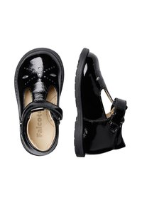 Schwarze Lackleder-Mary-Jane-Schuhe mit runder Zehenpartie, dekorativen Perforationen, verstellbarem Riemen und strukturiertem Gummisohle.
