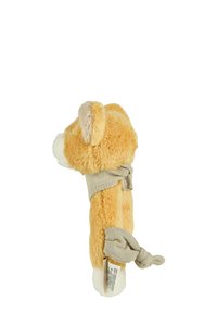 Plush toy in a light orange color with a soft texture. It features a beige fabric knot around the midsection and a small tail.