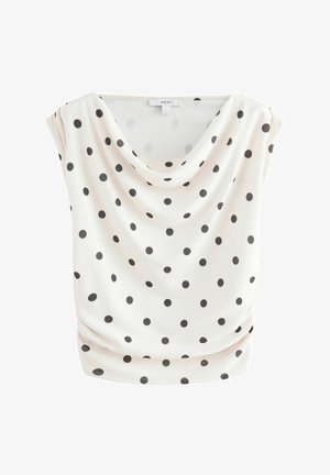 Balta palaidinė su gaubtu apykakle, dekoruota juodomis dėmėmis. Pagaminta iš minkštos, laisvai krintančios medžiagos, su trumpomis rankovėmis ir laisvu siluetu.