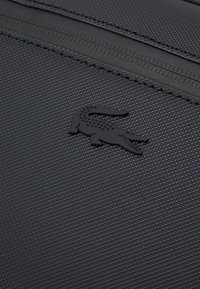 Lacoste NAOS UNISEX - Jostas soma - noir