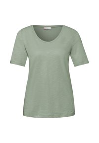 T-shirt pour femme à manches courtes, vert clair, avec encolure ronde, fabriqué en tissu légèrement texturé, étiqueté "Street One" à l'intérieur du col.