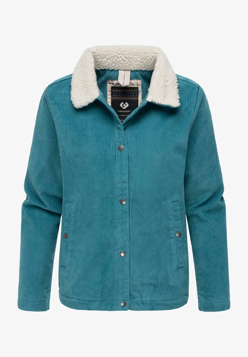 Teal kordjacka med vit fuskpälskrage, tryckknappar och sidofickor, med vertikal ribbad struktur genom hela plagget.