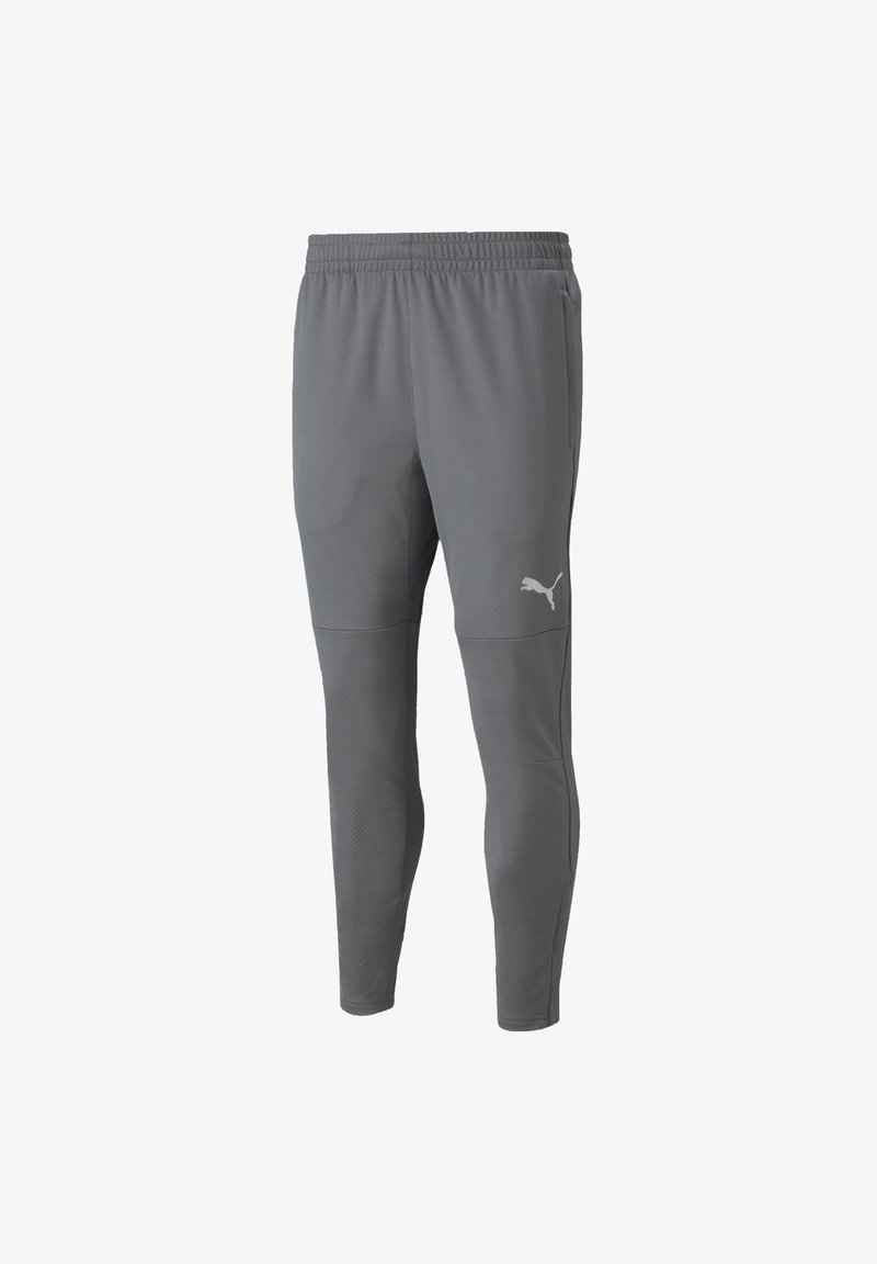 Graue Sporthosen aus strukturiertem Material, mit elastischem Bund, schmalem Schnitt und kleinem weißen Logo am linken Oberschenkel.