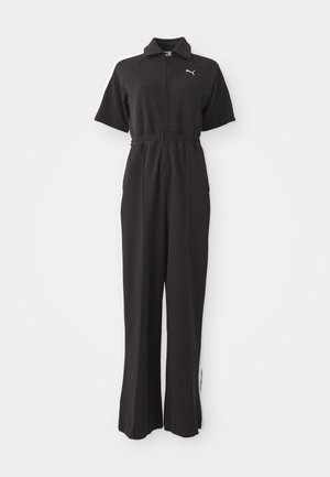 Black jumpsuit with short sleeves, zip front, elastic waistband, and wide legs. Features white accents and a small logo on the chest.