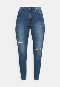 Dark blue skinny jeans made of denim, featuring distressed detailing with rips on the knees, standard five-pocket design, and a button closure.