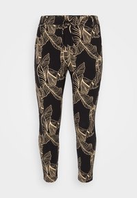 Svarta leggings med ett mönster av guldblad, elastiskt midjeband med snörning och figursydd passform. Tillverkade av mjukt, stretchigt material.