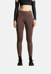 Braune Leggings aus dehnbarem Stoff mit glatter Textur, mit hohem Taillenbund und körpernahem Schnitt.